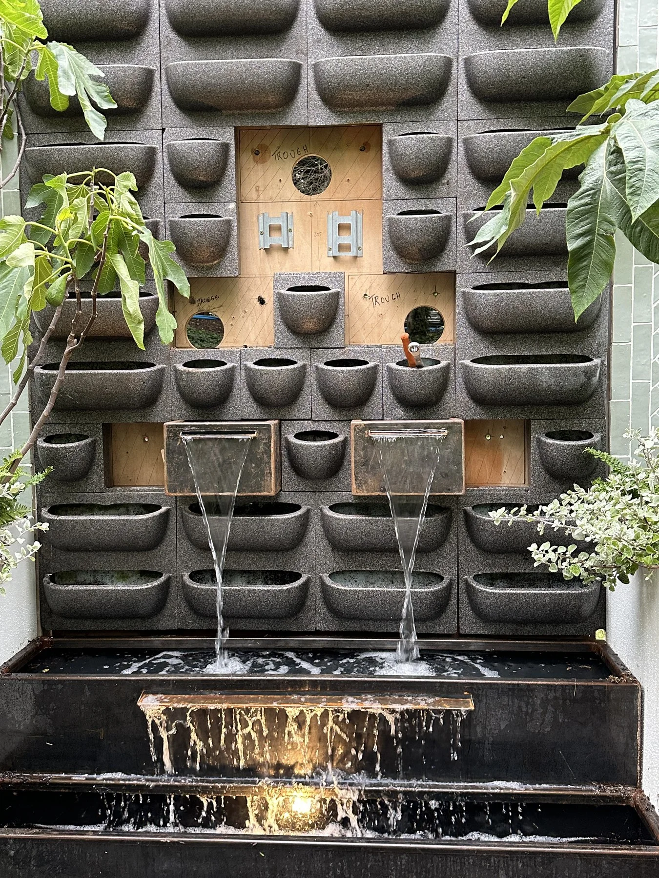 Close detail of the water wall during construction