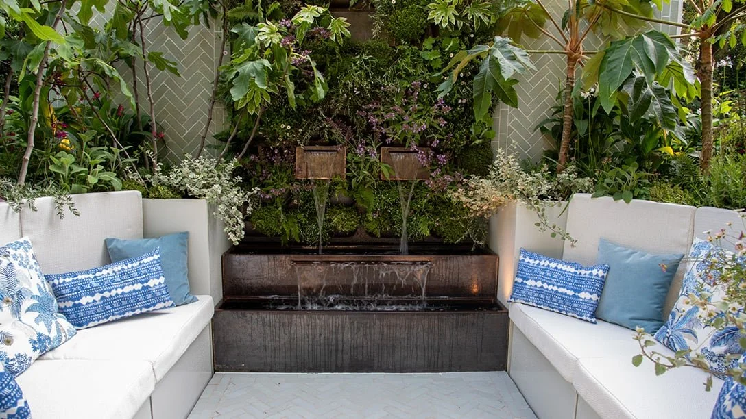 The Anywhere Courtyard at RHS Chelsea Flower Show 2024 with water feature, layered planting and seating