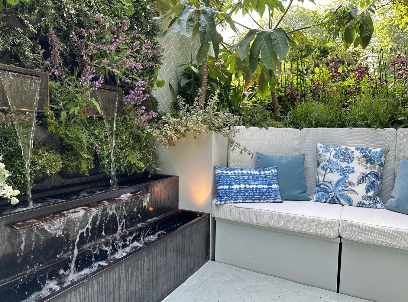 The Anywhere Courtyard with water wall, built-in seating and layered planting